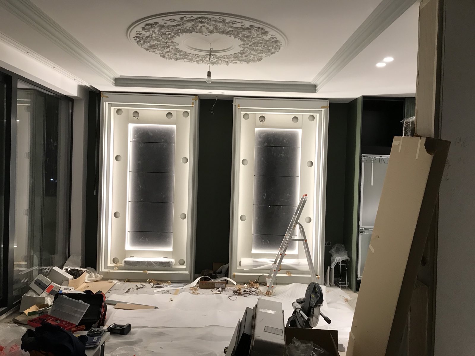 The illuminated display cabinets during installation