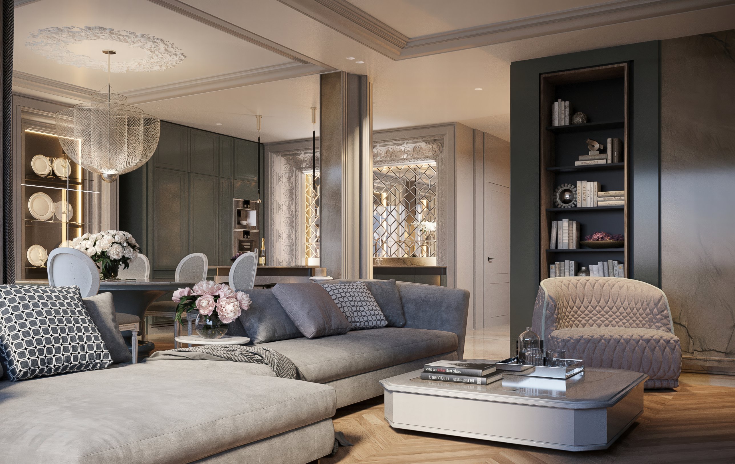 Living room with a deep corner sofa, a quilted armchair and a niche of open shelving, opening onto the dining room and kitchen