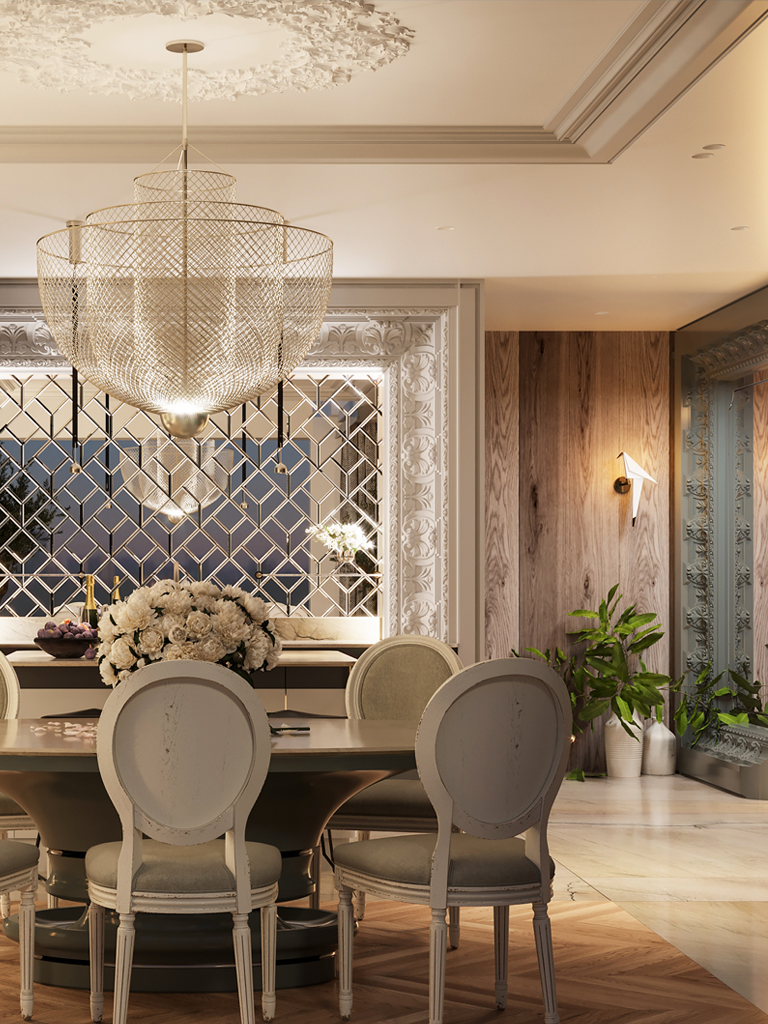 The wire-mesh chandelier glowing above the dining table before the mirrored wall