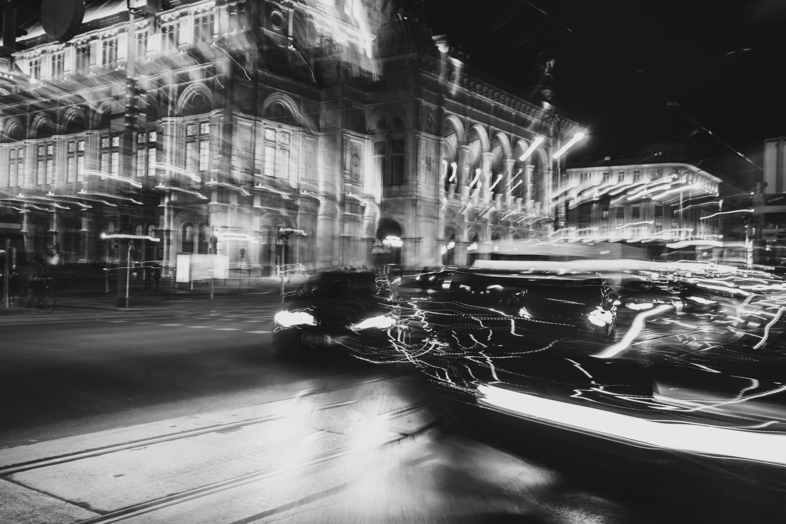 City street at night with motion-blurred car lights