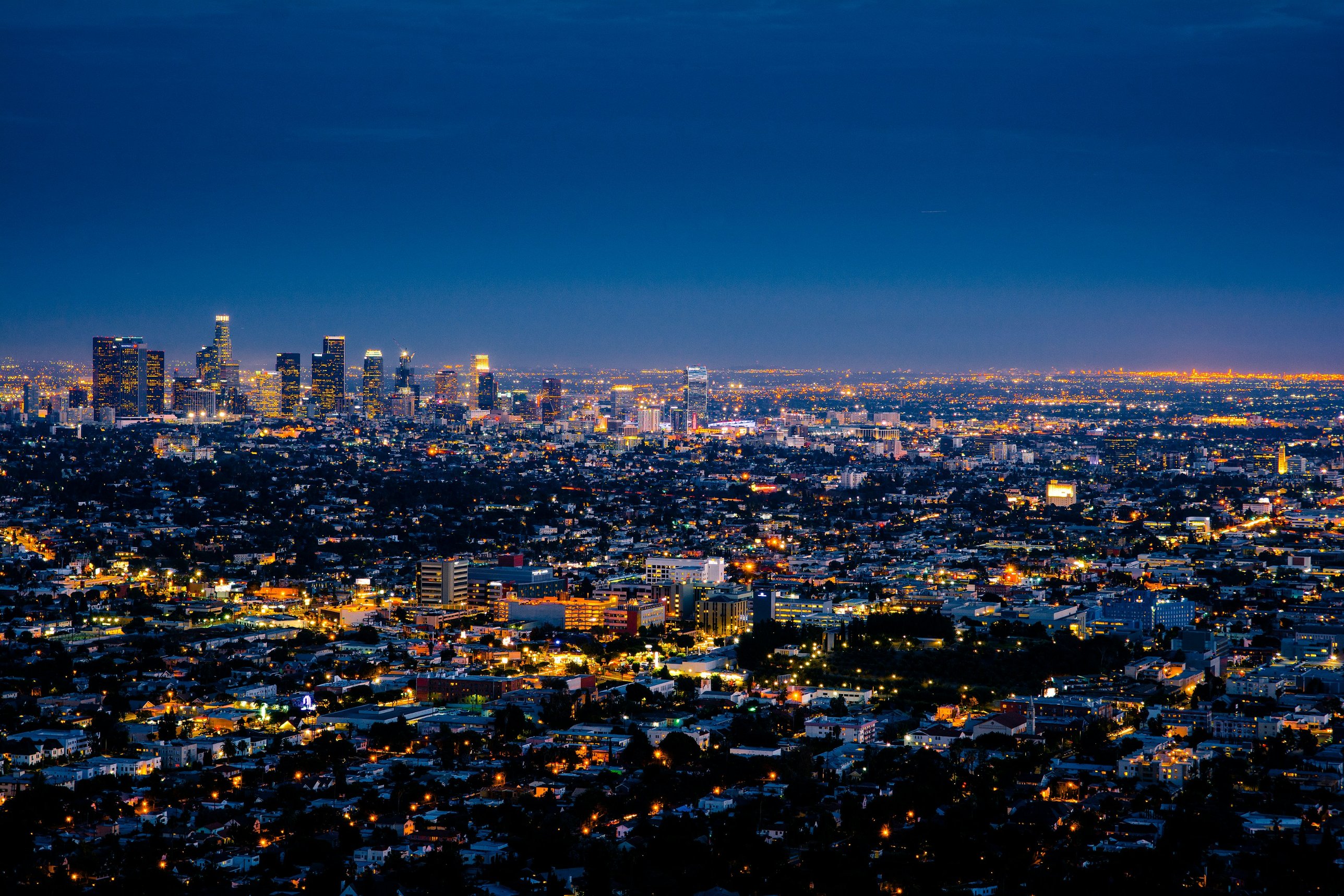 Los Angeles at dusk, seen from the hills, with the downtown towers on the horizon