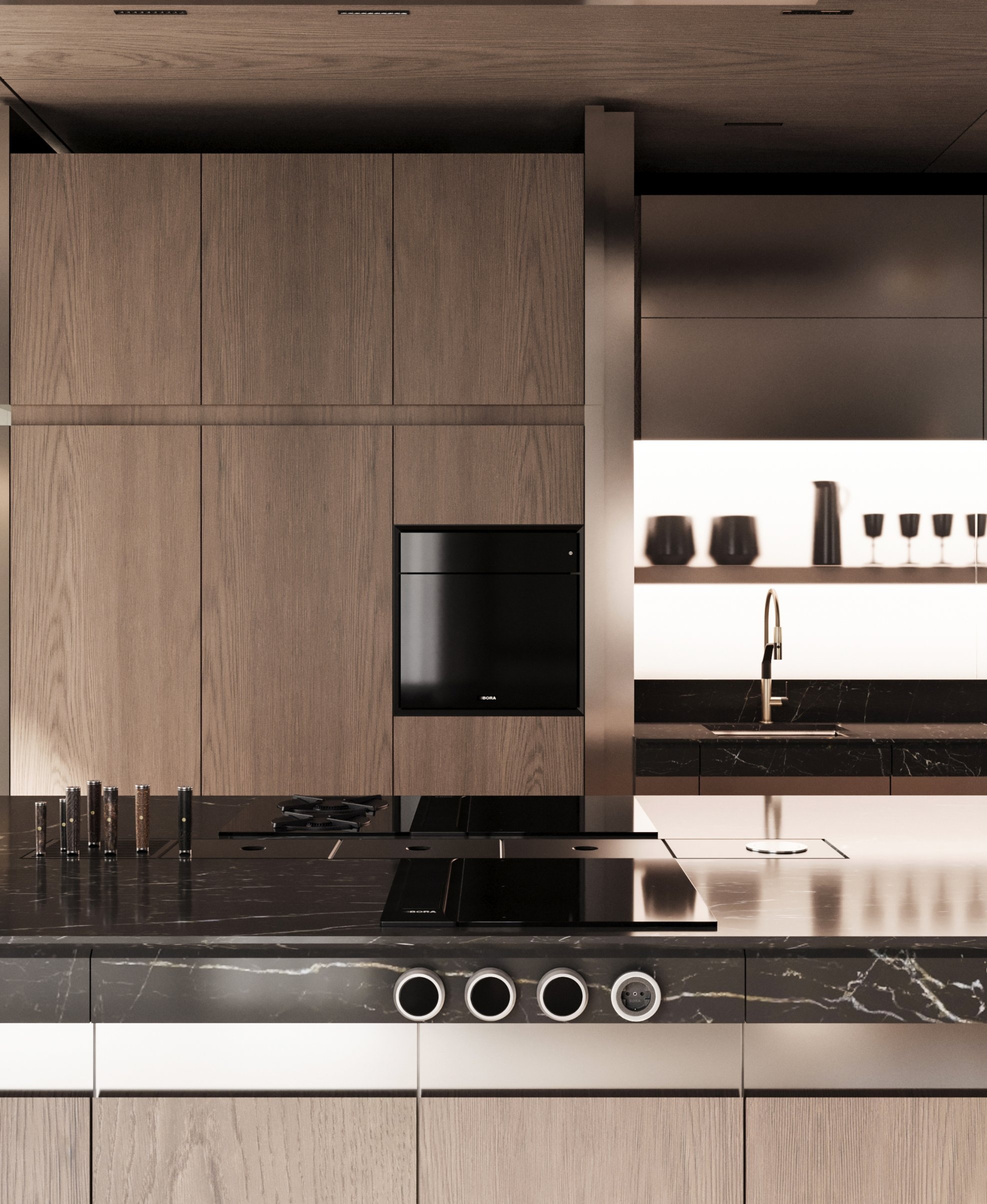 Timber tall units, a black oven and the stone island edge with round metal fittings