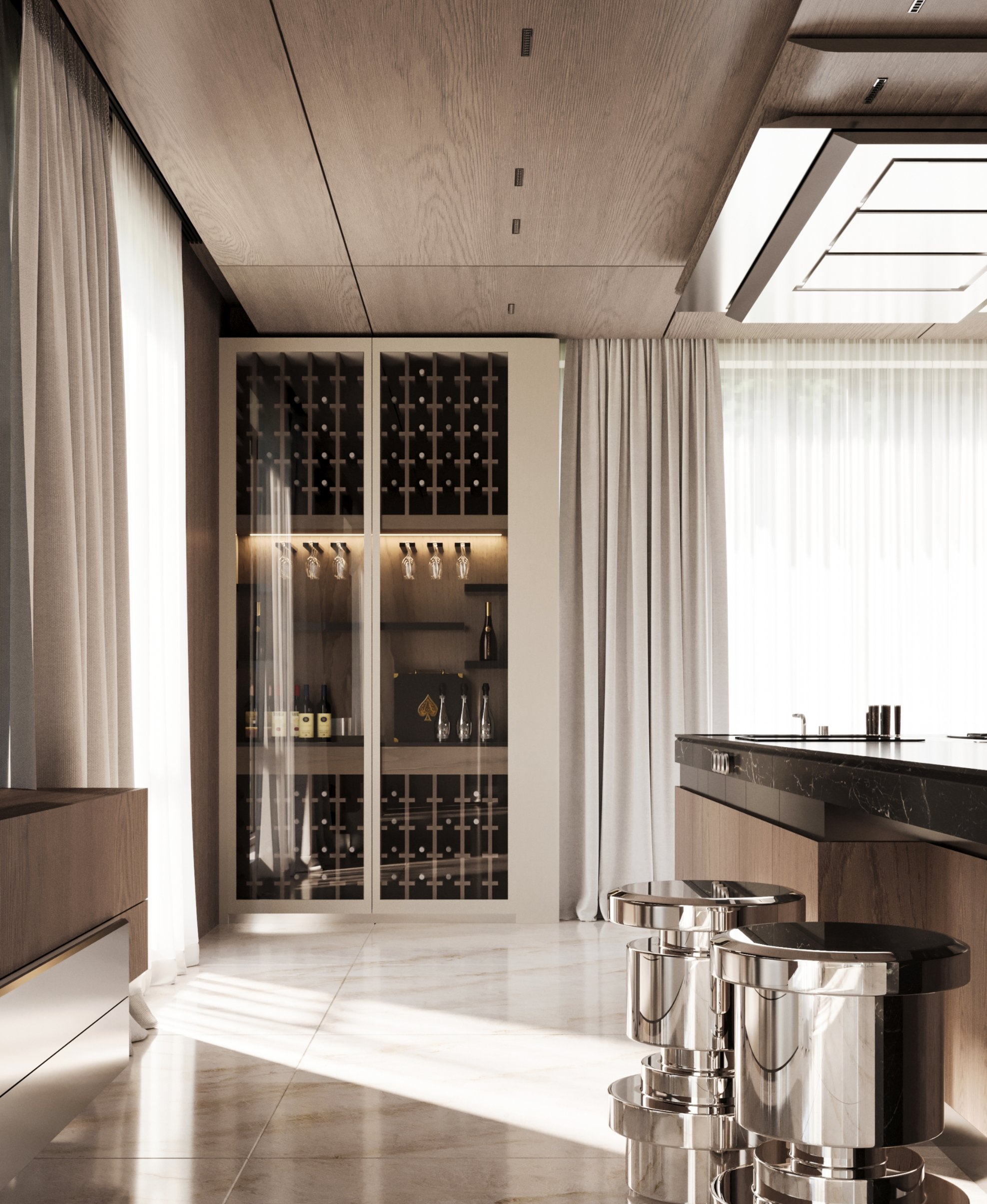 A glass-fronted wine cabinet with lit glass racks beside the island and metal stools