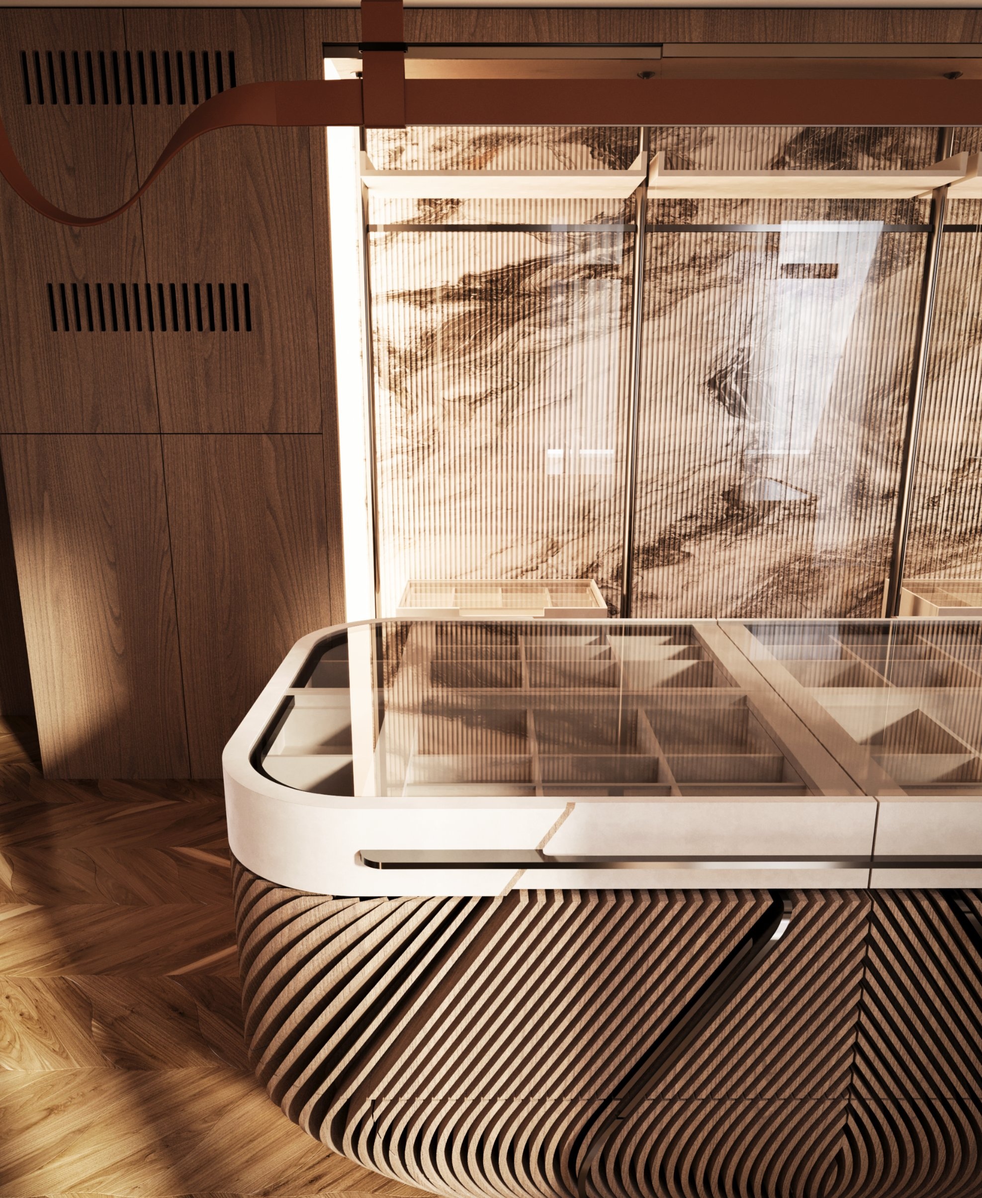 The island’s glass top over compartments, before lit wardrobes with fluted glass