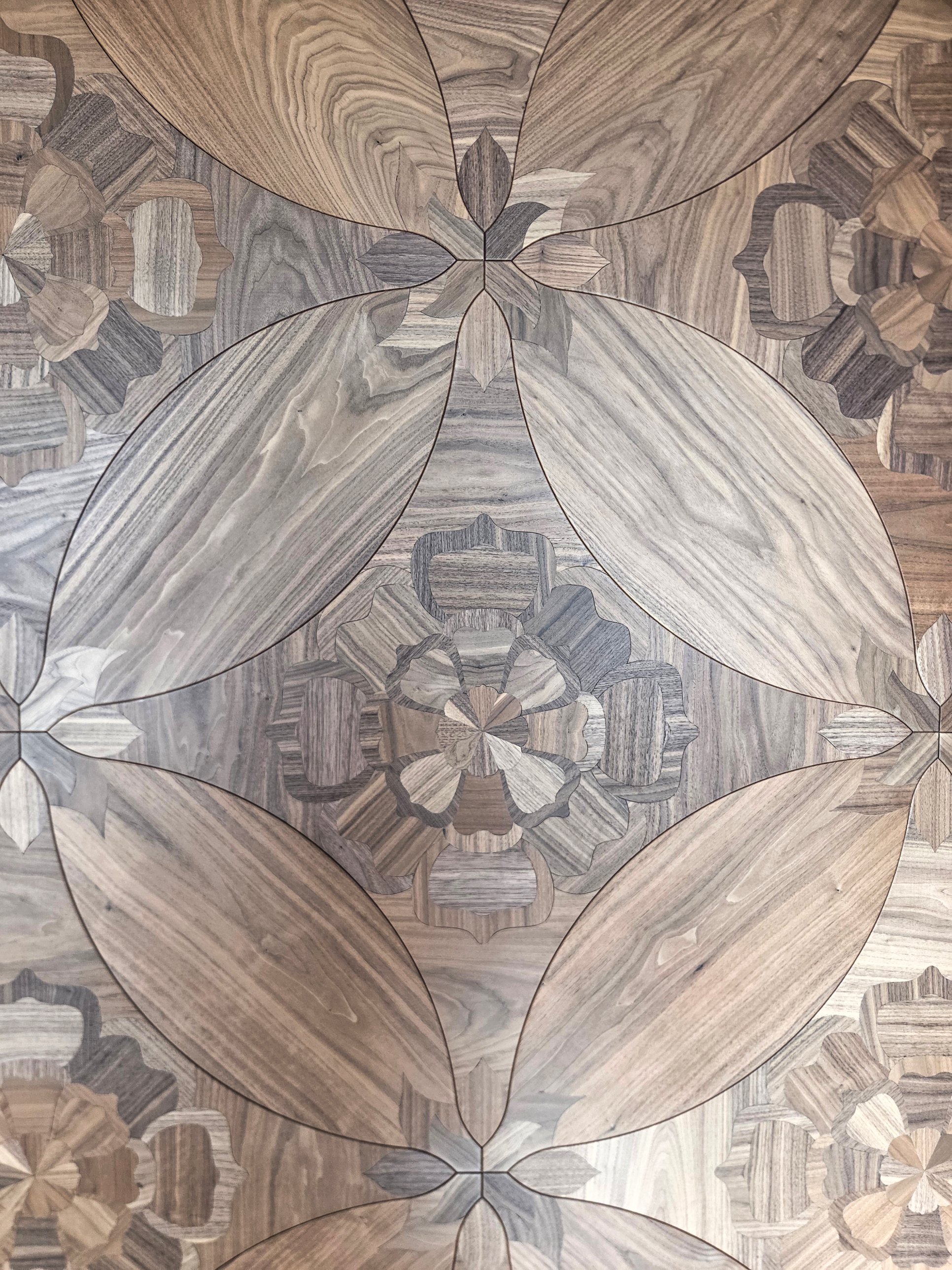 Close view of the floral walnut marquetry