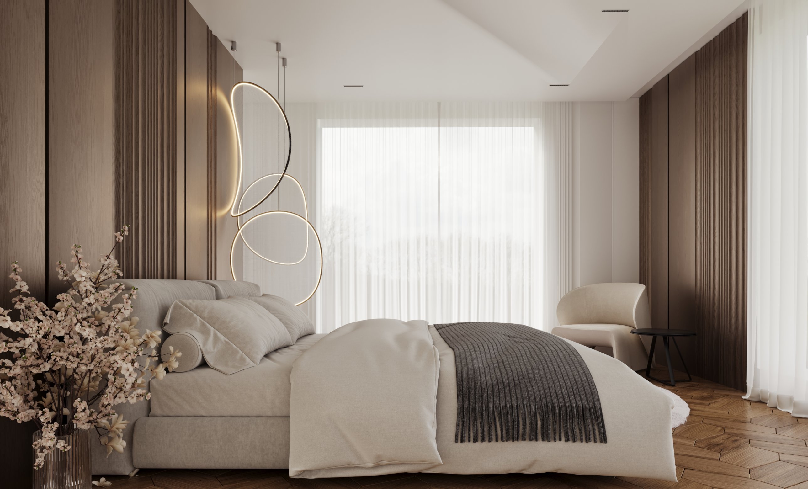 A secondary bedroom with vertical timber detailing, pale upholstery and sheer curtains