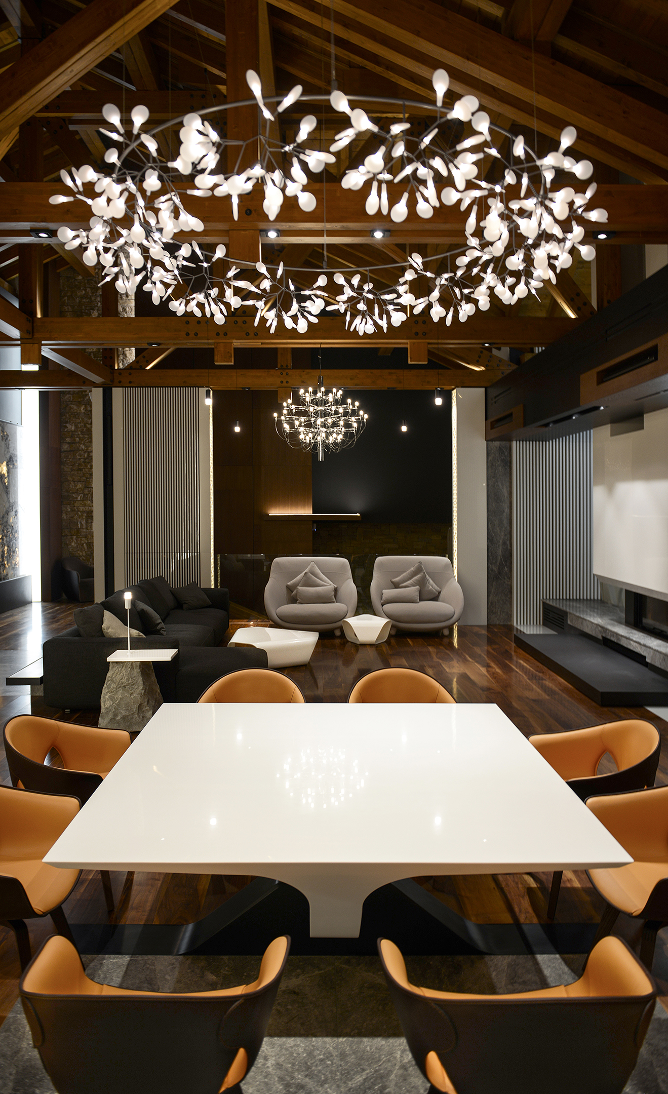 The dining table from its head, with the living area beyond