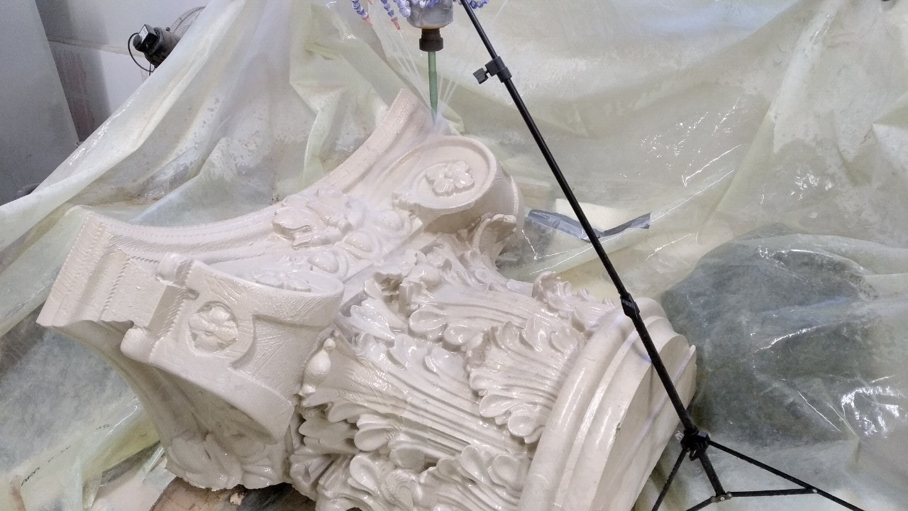 A stone capital being machined