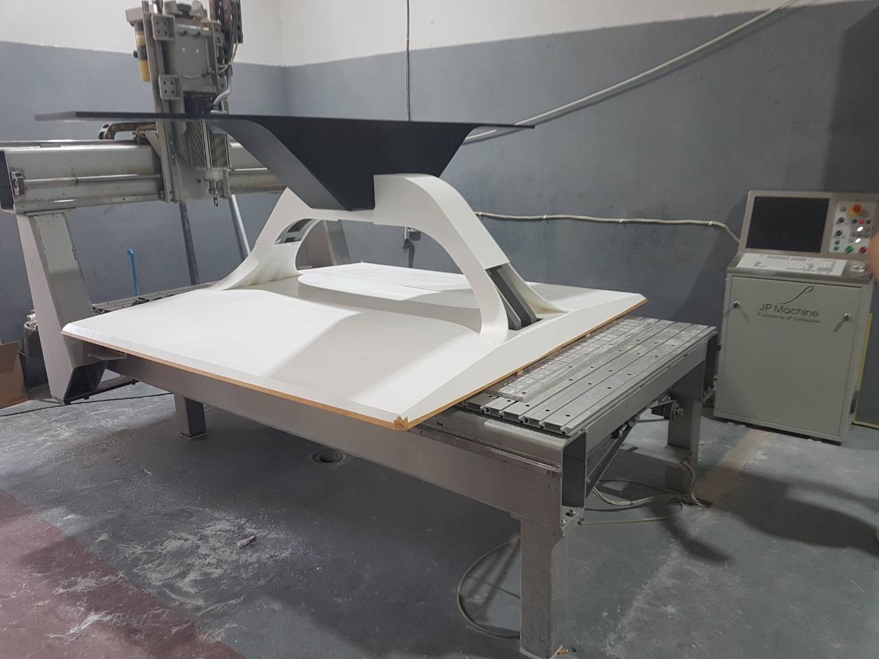 The dining table base on the CNC machine