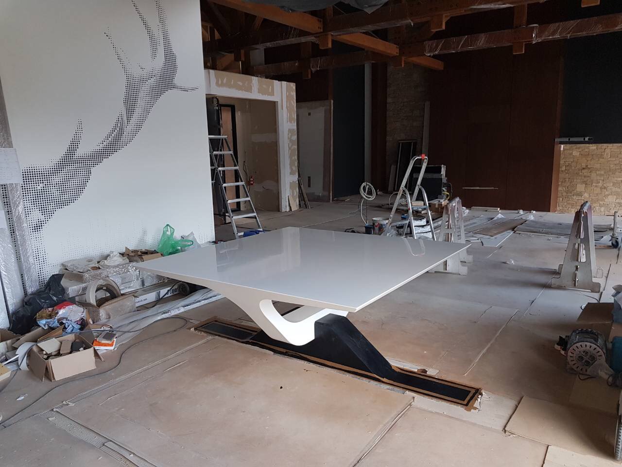The dining table installed on site before finishing