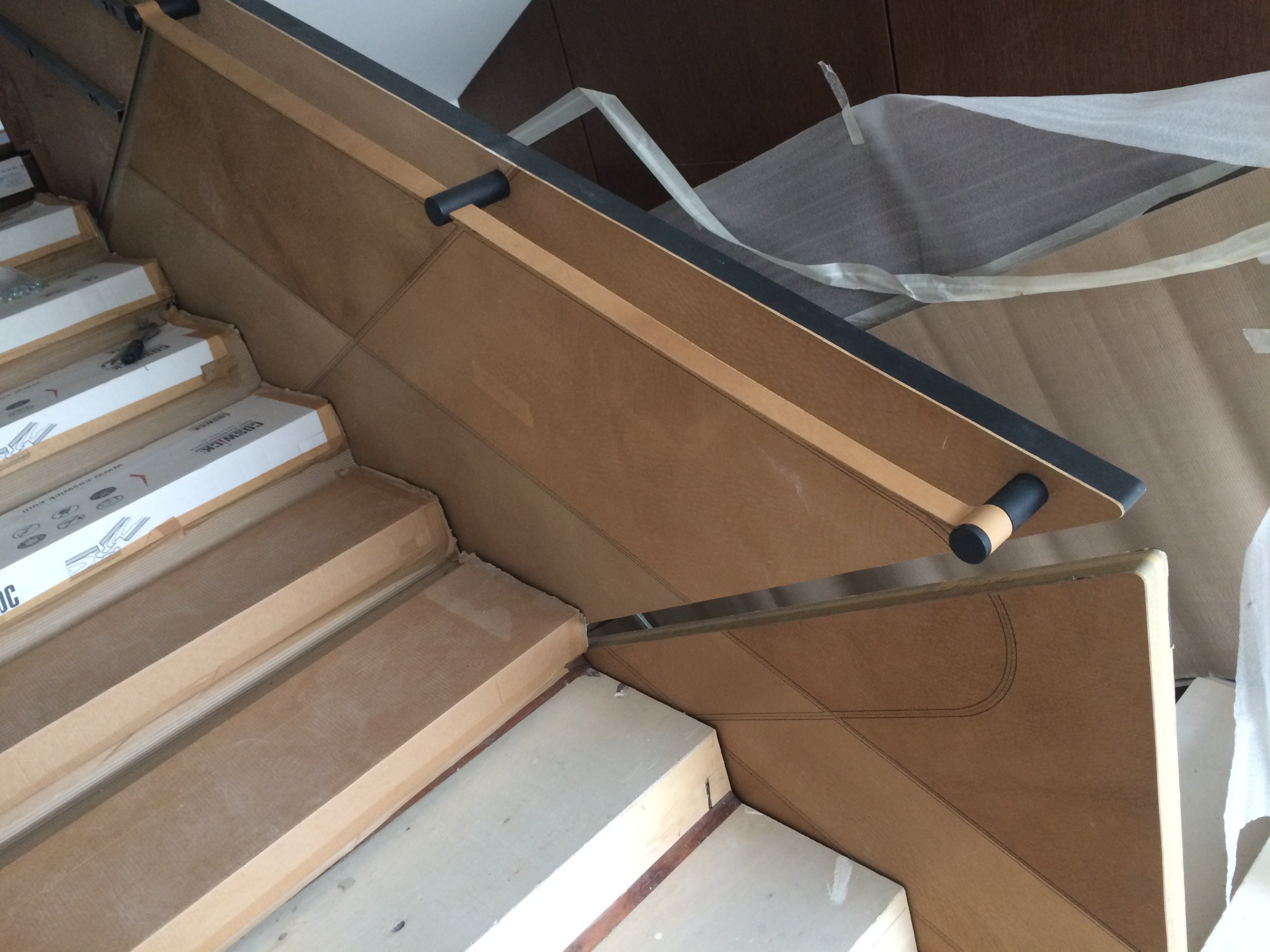 Stair balustrade panels before leather cladding