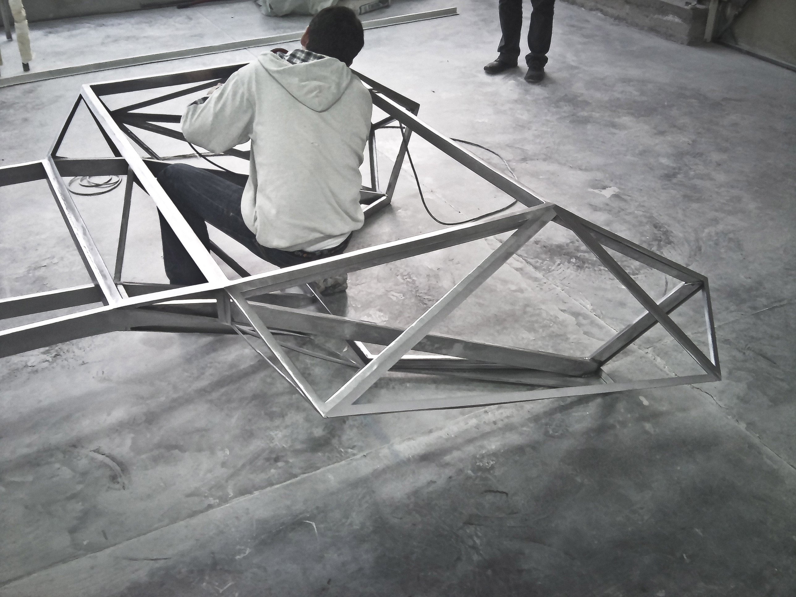 Welding the faceted steel frame