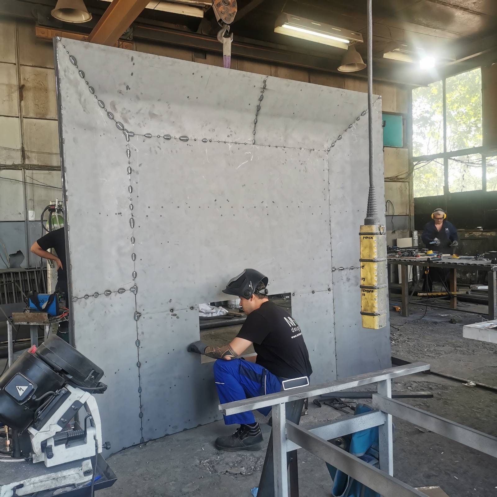 The steel fireplace shell being welded in the workshop