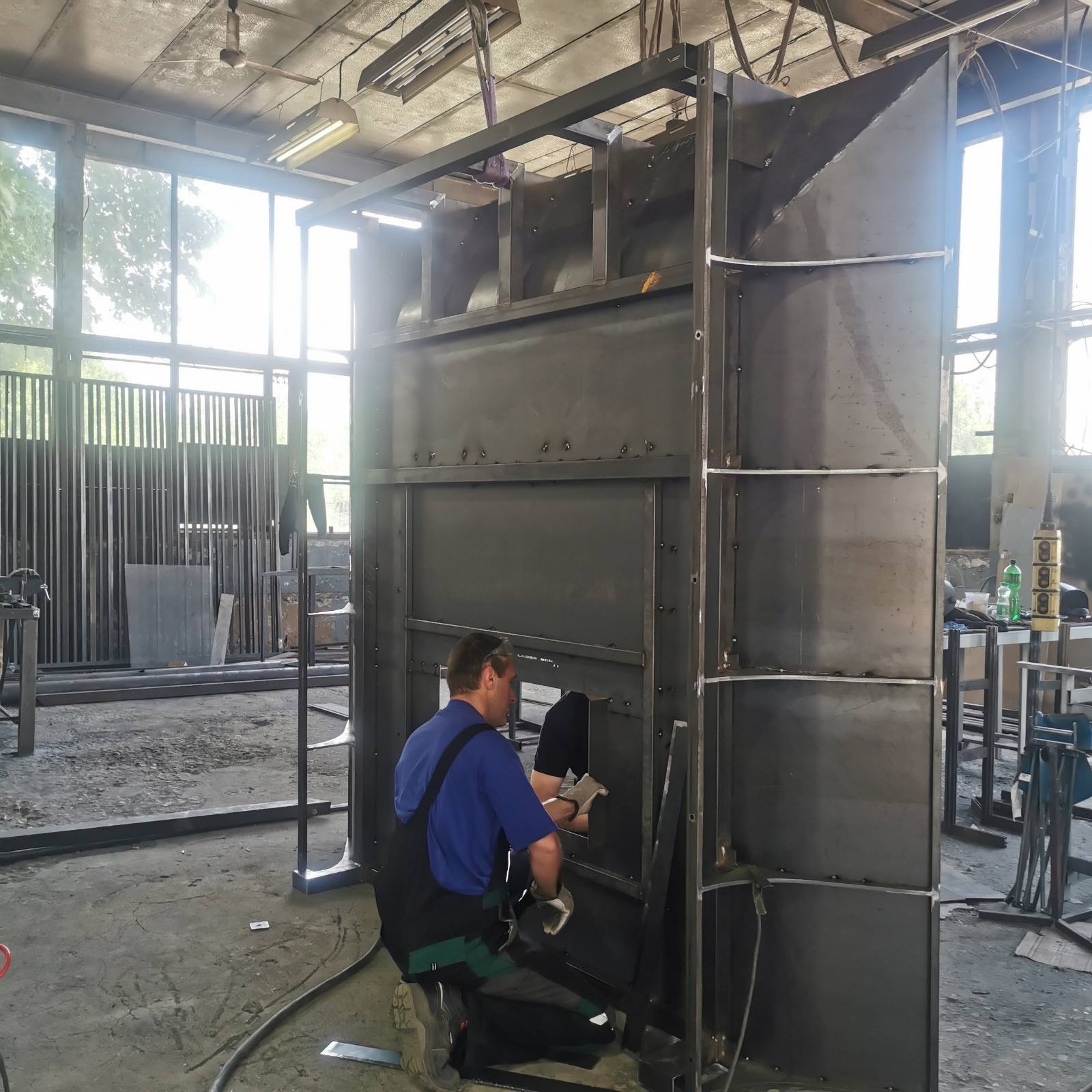 Welding the internal steel frame of the fireplace