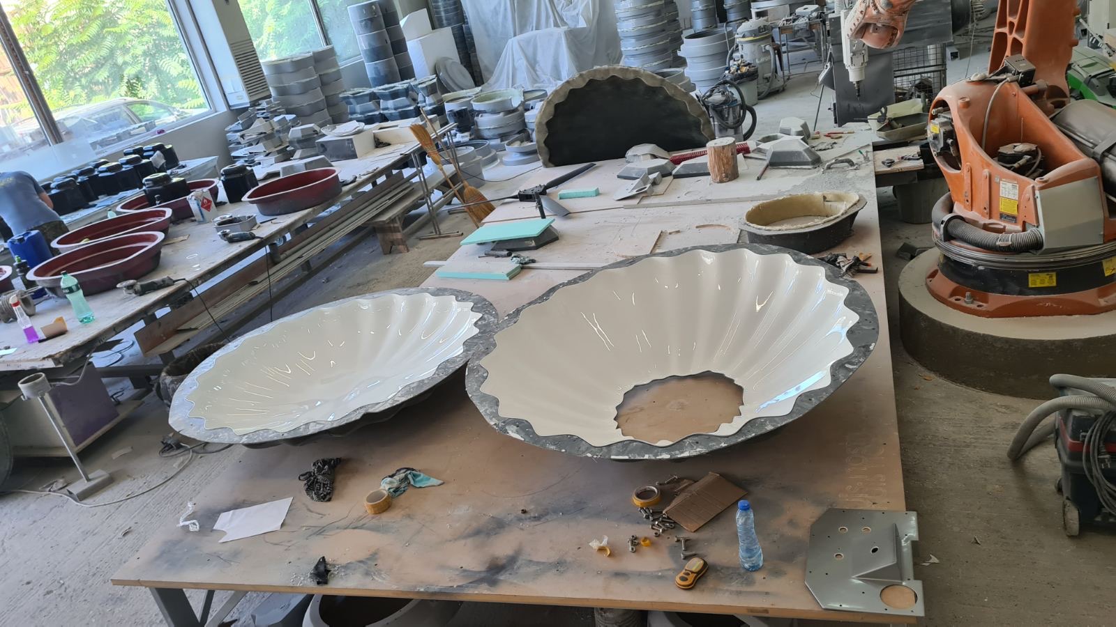 The chandelier’s folded shells taking shape on the workshop table