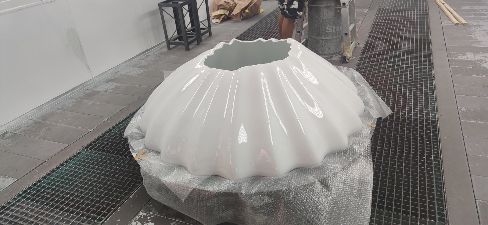 The finished white gloss chandelier shell, wrapped for transport