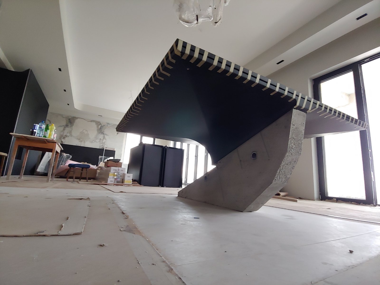 A sculptural piece positioned during installation