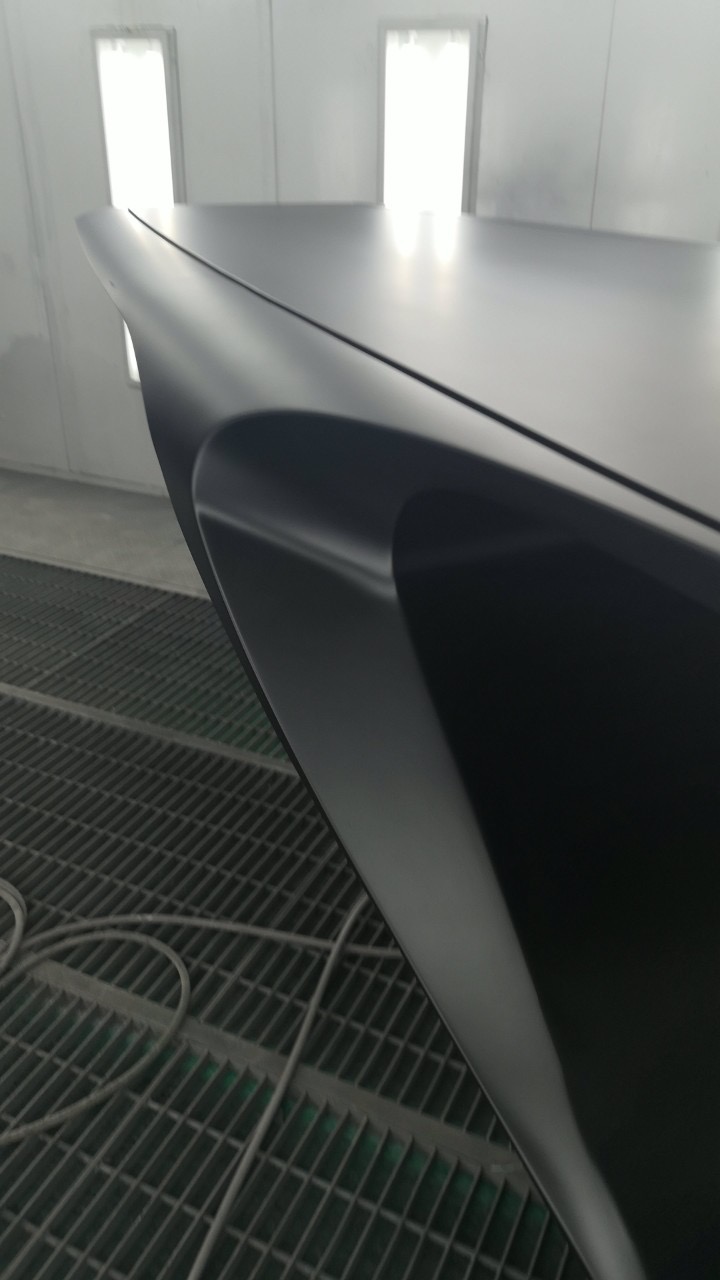 The sweeping underside of the table in the spray booth