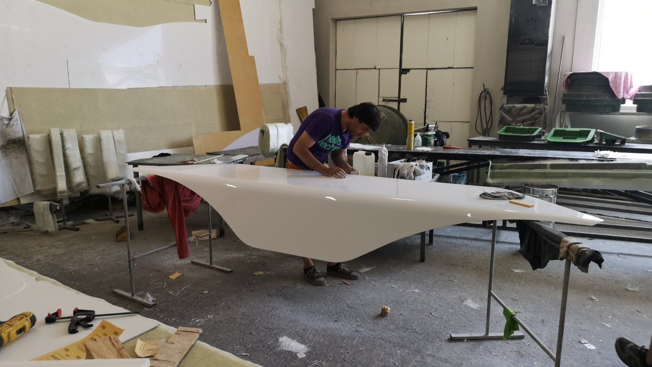 Hand-finishing the reception desk